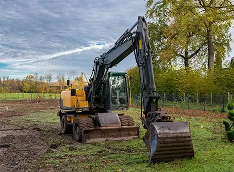 Excavator working a cleared development site.